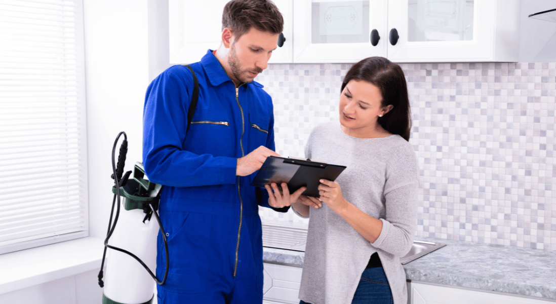 male pest expert giving a lady home owner tips for pest free home