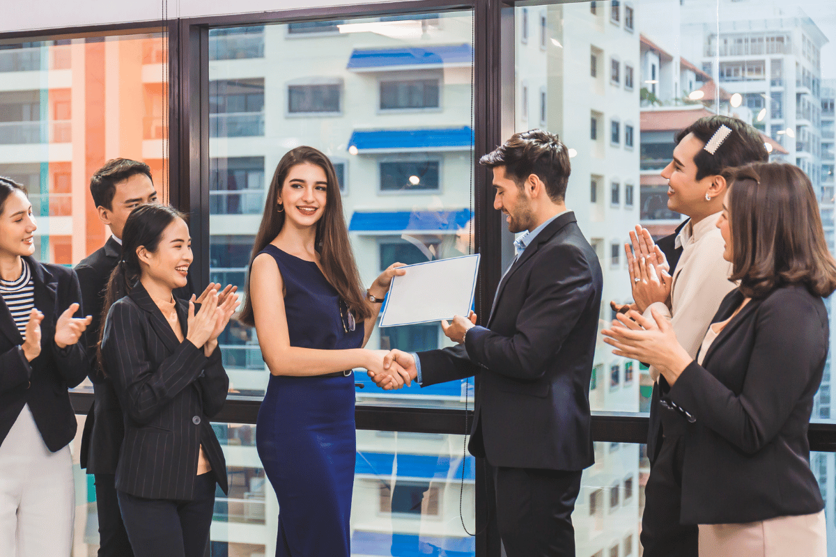 group of man and women , certificate and handshake